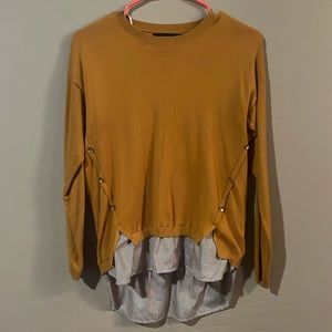 Yellow sweater, buttons down the side, bottom sewed in stripped fabric